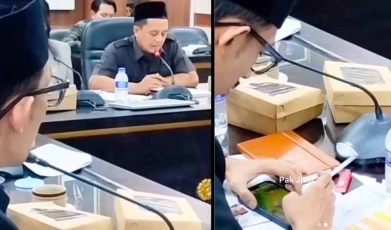 Anggota DPRD Jember terlihat memainkan game di ponselnya sambil memegang rokok saat Rapat Dengar Pendapat (RDP) Komisi D yang membahas layanan kesehatan, momen yang kemudian viral dan menuai sorotan publik. (Sumber Foto: Istimewa)
